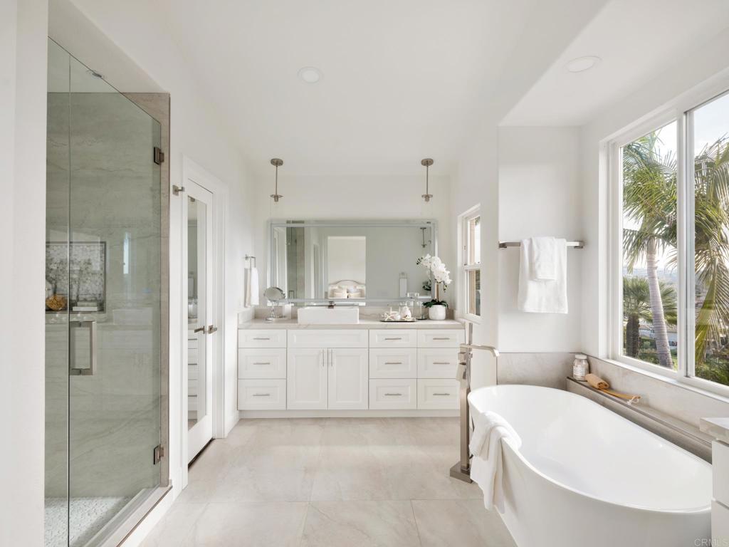 6160 Paseo Tapajos Carlsbad, CA 92009 - Photo 6 of 16 a bathroom with a granite countertop tub sink shower and mirror