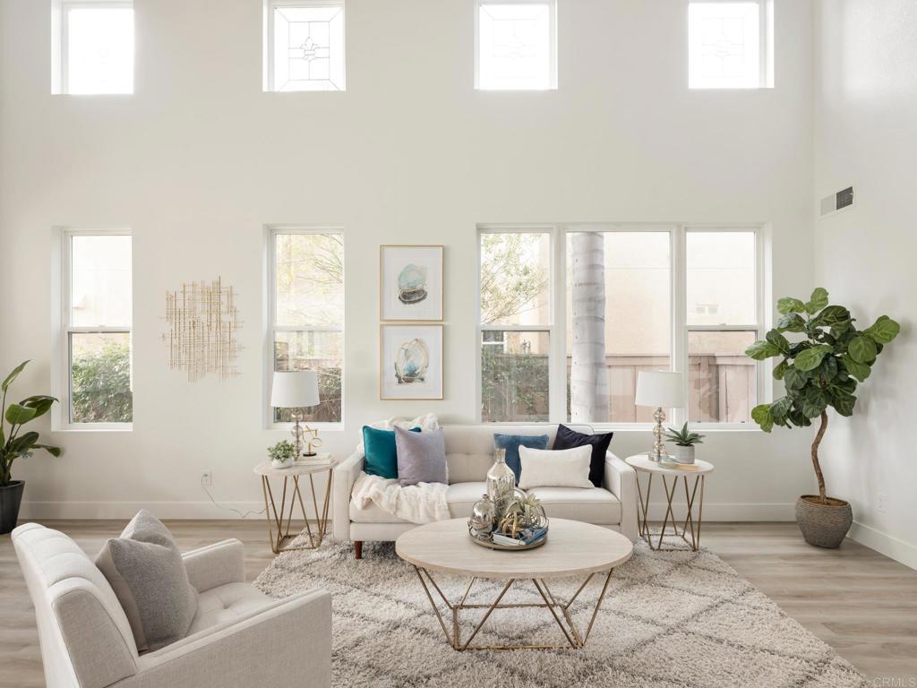 6160 Paseo Tapajos Carlsbad, CA 92009 - Photo 8 of 16 a living room with furniture and a large window