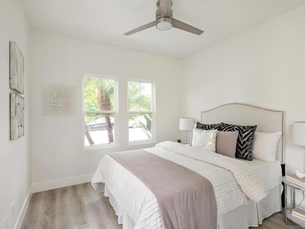 6160 Paseo Tapajos Carlsbad, CA 92009 - Photo 10 of 16 a bedroom with a bed and a window