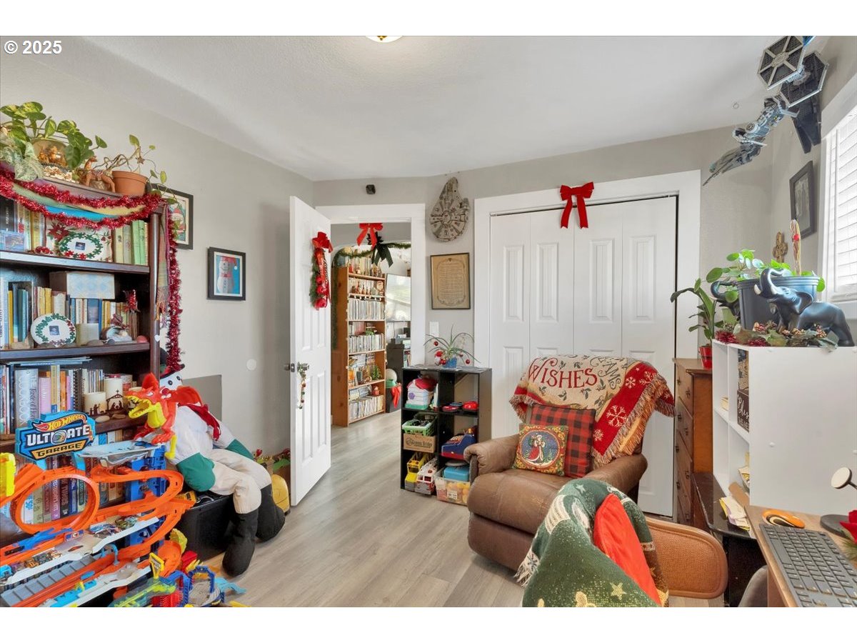 Undisclosed Address Lebanon, OR 97355 - Photo 12 of 34 a living room with lots of baby toys