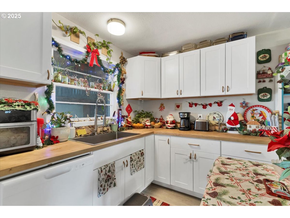 Undisclosed Address Lebanon, OR 97355 - Photo 16 of 34 a kitchen with granite countertop lots of clutter and cabinets
