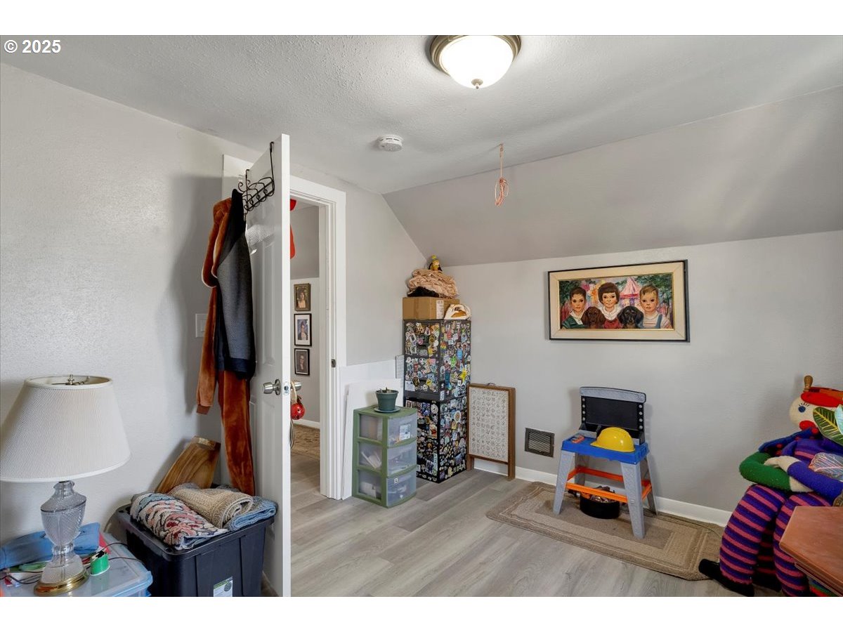 Undisclosed Address Lebanon, OR 97355 - Photo 23 of 34 a living room with furniture a flat screen tv and a lamp