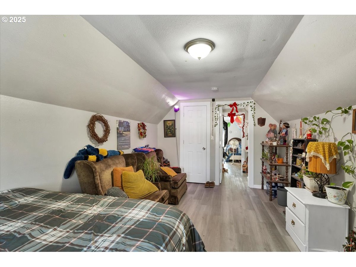 Undisclosed Address Lebanon, OR 97355 - Photo 29 of 34 a bedroom with furniture and wooden floor