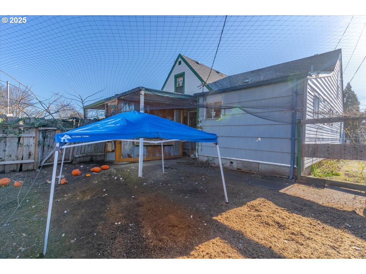 Undisclosed Address Lebanon, OR 97355 - Photo 33 of 34 a backyard of a house with barbeque oven table and chairs