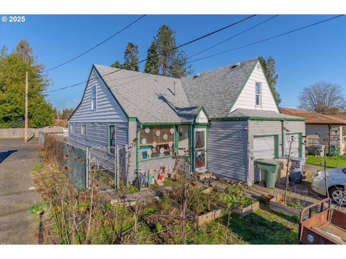 Undisclosed Address Lebanon, OR 97355 - Photo 5 of 34 a view of a house with brick walls and potted plants