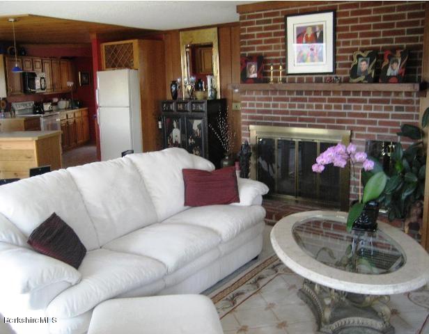 234 East Slope Road Richmond, MA 01201 - Photo 4 of 8 a living room with furniture and a fireplace