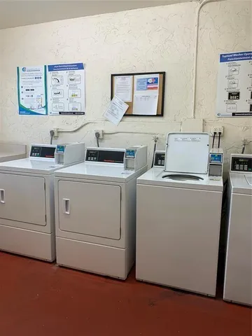a view of cabinets and washer dryer