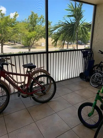 a view of a chair and tables in the patio