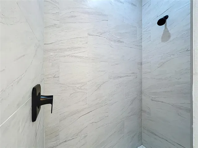 a backyard of a house with plants and trees