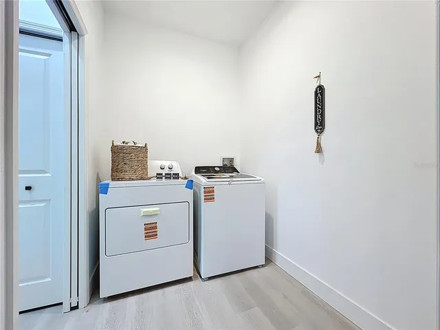 an aerial view of a house with swimming pool and big yard