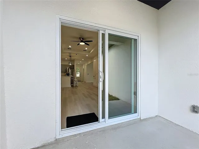 a view of a livingroom with furniture window and wooden floor