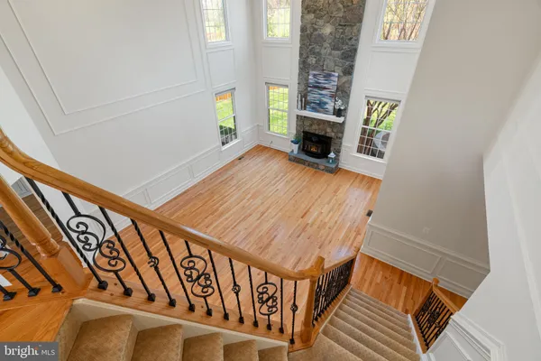 a view of a house with a yard and tree s