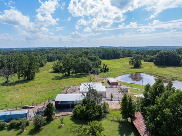 Aerial View of Buildings with part of the acreage in the background.