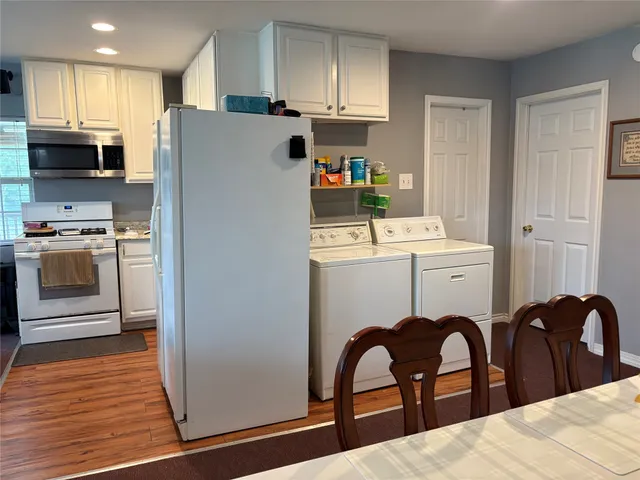 a view of an empty room and a window