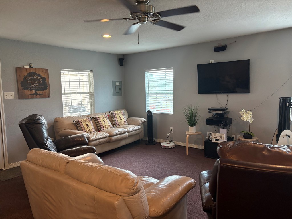 12151 State Highway 75 North Buffalo, TX 75831 - Photo 14 of 50 a living room with furniture and a flat screen tv