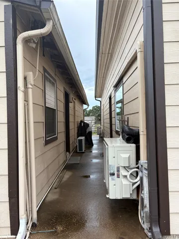 a view of a room with furniture and windows