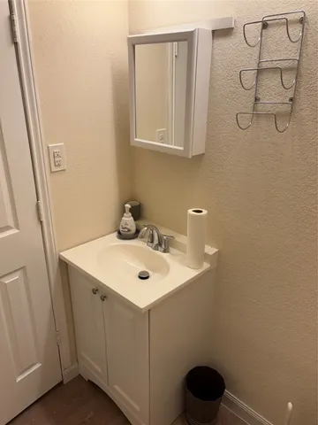 a bathroom with a shower a toilet and sink