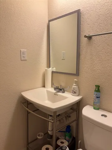 a view of a balcony with lake view and a large window