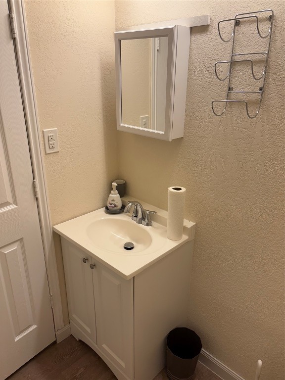 12151 State Highway 75 North Buffalo, TX 75831 - Photo 30 of 50 a bathroom with a toilet a sink and mirror