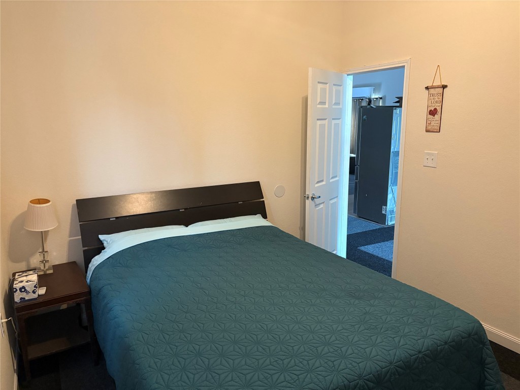 12151 State Highway 75 North Buffalo, TX 75831 - Photo 34 of 50 a bedroom with a bed and a table