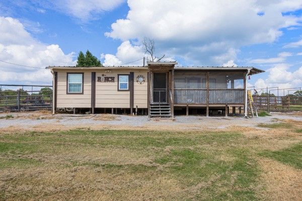 12151 State Highway 75 North Buffalo, TX 75831 - Photo 6 of 50 a front view of a house with a yard