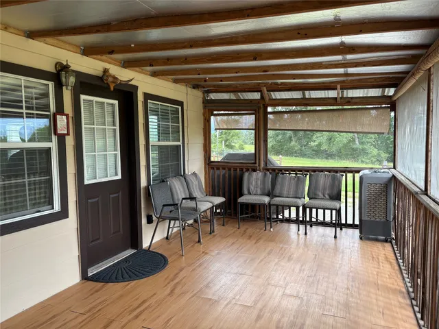 a very nice looking dining room with kitchen island a stove a table and a refrigerator