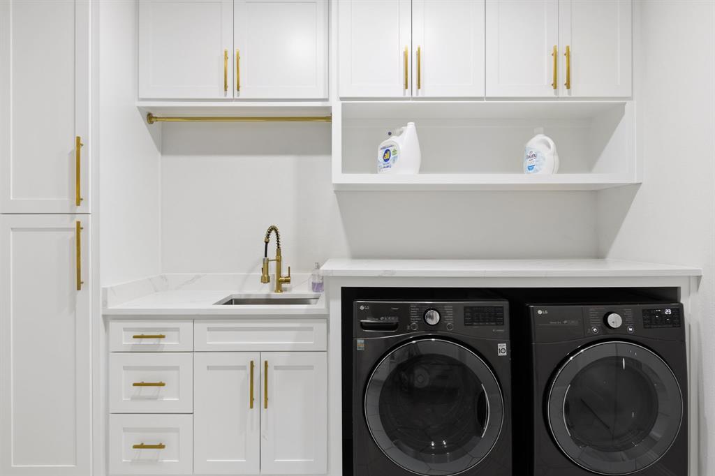 2116 Randas Way Rockwall, TX 75087 - Photo 17 of 40 a close view of a sink with washer and dryer