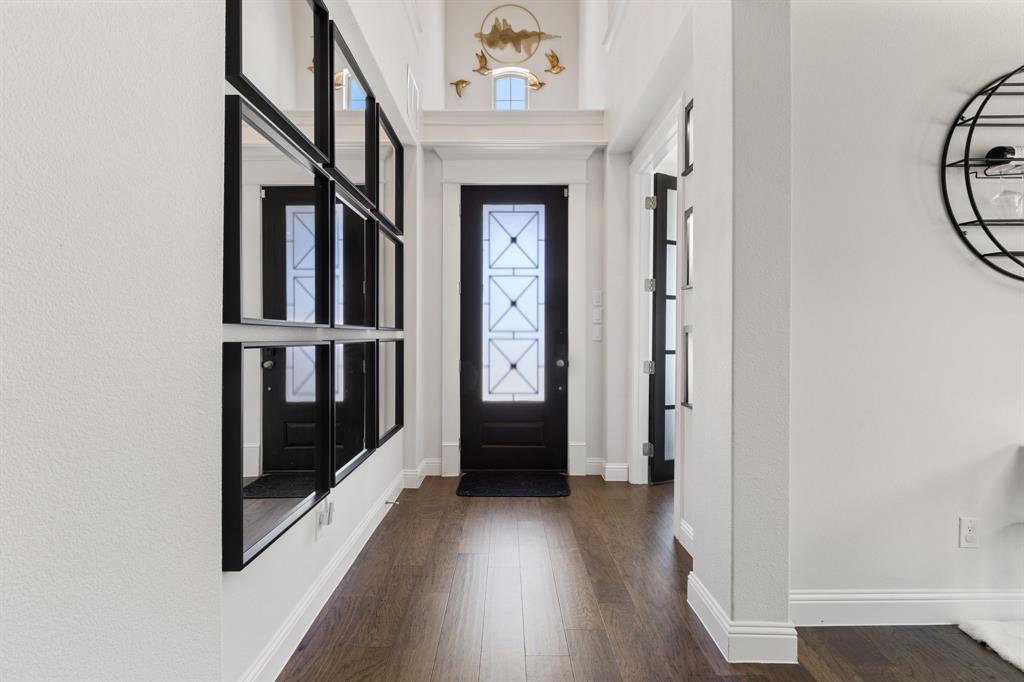 2116 Randas Way Rockwall, TX 75087 - Photo 22 of 40 a view of an entryway with wooden floor door and windows