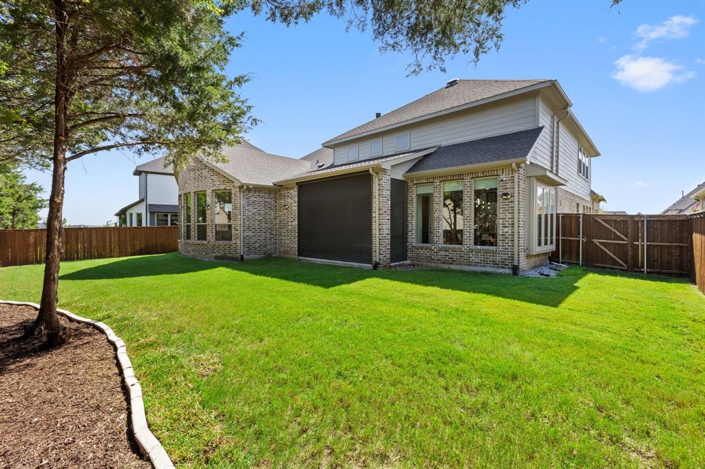 2116 Randas Way Rockwall, TX 75087 - Photo 35 of 40 a front view of house with yard and green space