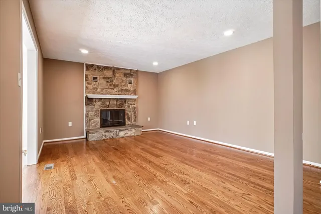 a view of an entryway with wooden floor and door