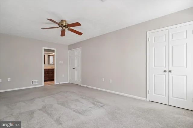 a bathroom with a sink double vanity and a shower