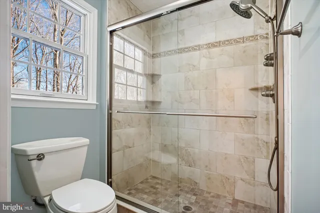 a bathroom with a double vanity sink and mirror