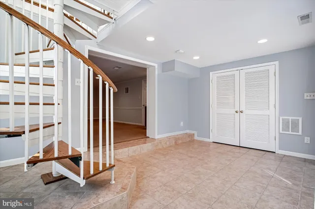 a spacious bathroom with a tub and shower