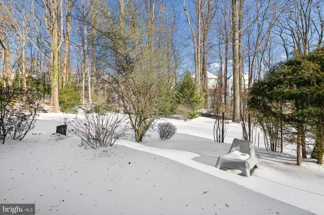 a view of an entryway with wooden floor and stairs