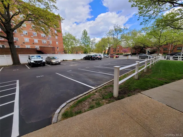 an outdoor space with lots of white furniture