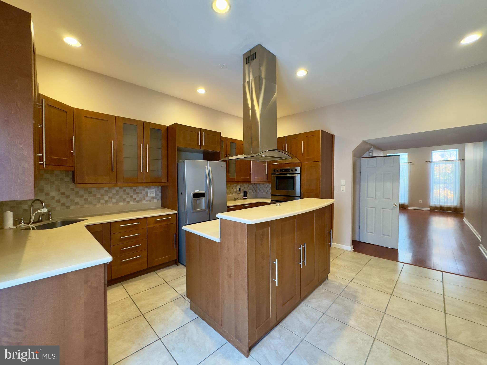 1812 North Calvert Street Baltimore, MD 21202 - Photo 16 of 24 a kitchen with stainless steel appliances a sink and cabinets