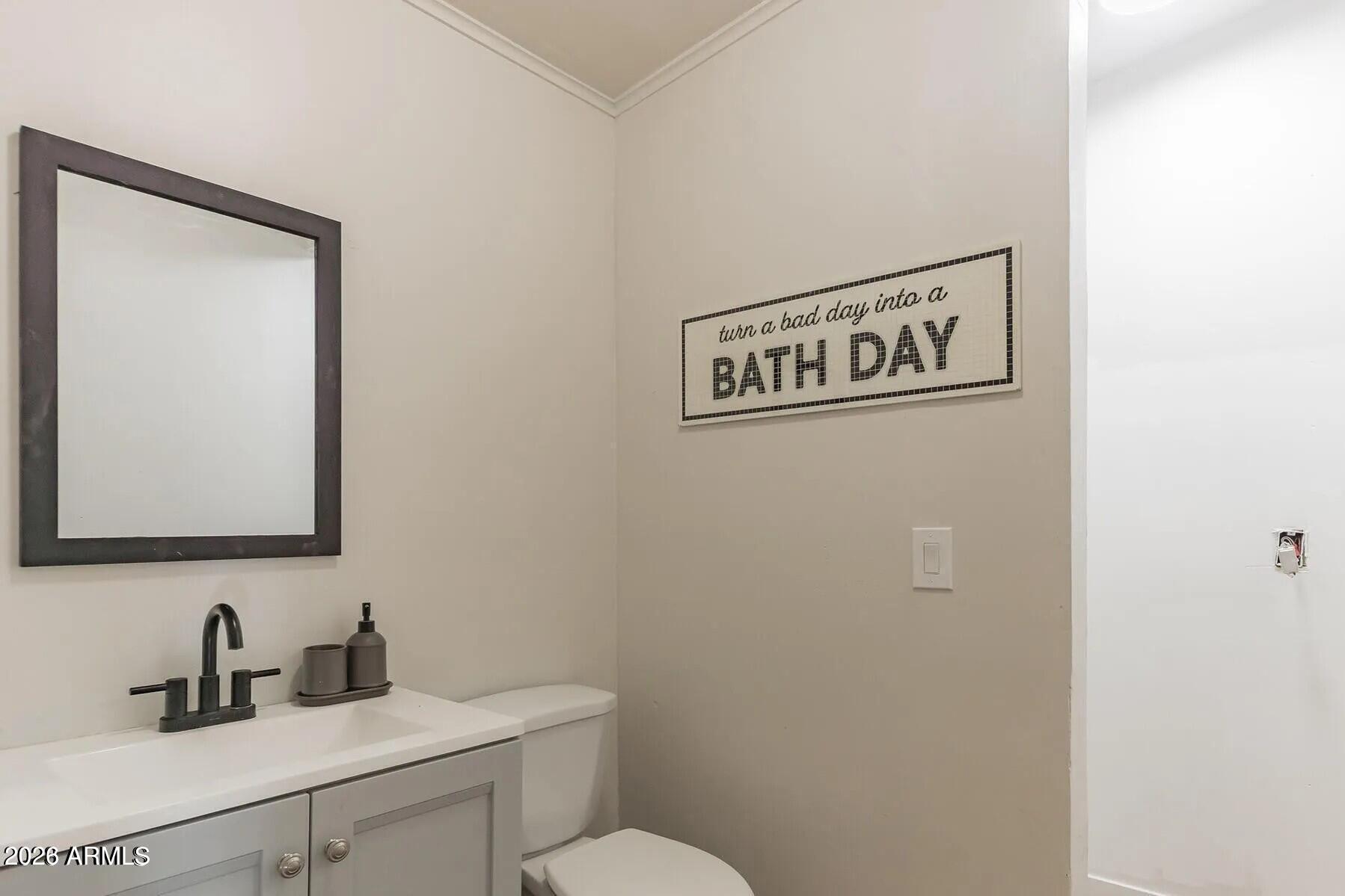 5065 Forest View Road Lakeside, AZ 85929 - Photo 14 of 24 a bathroom with a sink a toilet and mirror