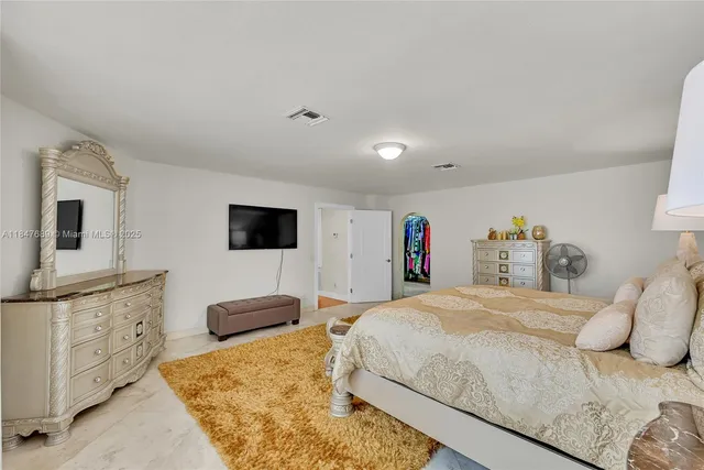 a bathroom with a double vanity sink toilet and shower