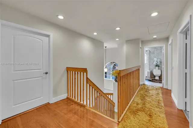 a bedroom with a bed and a dresser in it