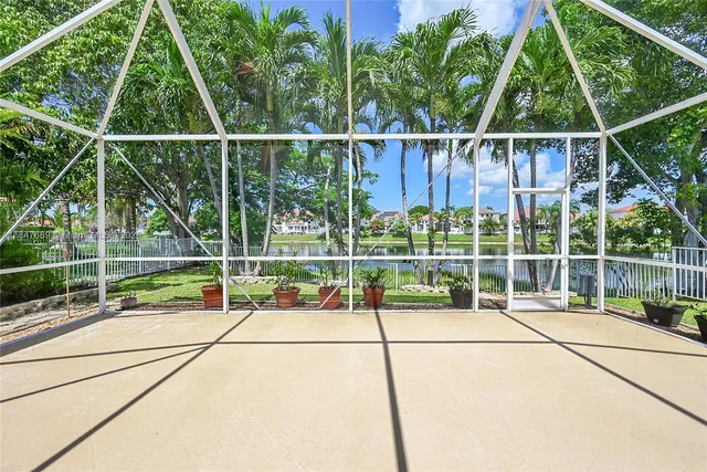 an aerial view of multiple houses with yard