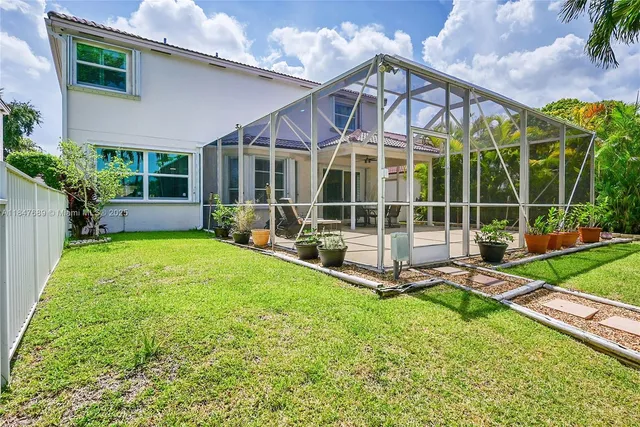 an aerial view of a house with a garden
