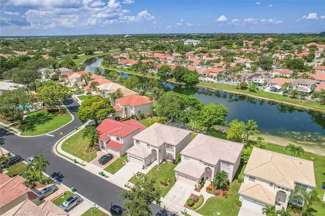 an aerial view of a house with a lake view