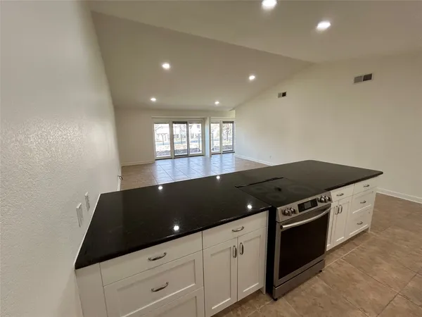 a kitchen with a stove and a cabinet