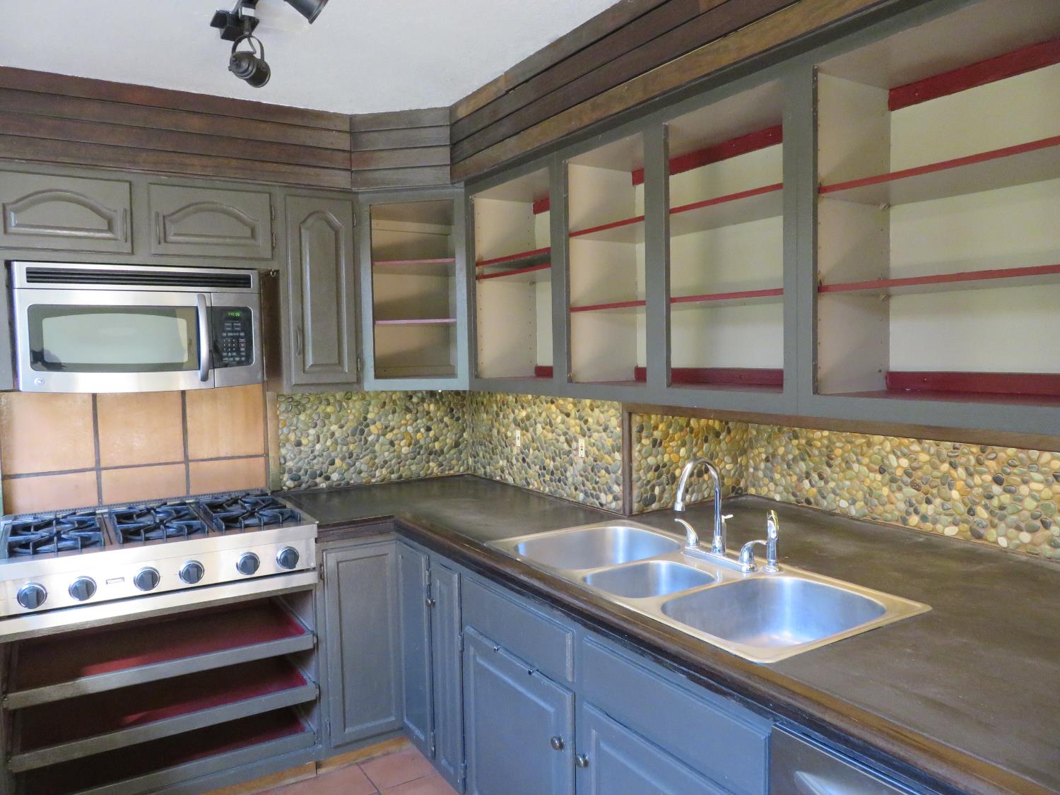 2400 Bald Mountain Road West Point, CA 95255 - Photo 12 of 68 a kitchen with stainless steel appliances granite countertop a sink stove and cabinets