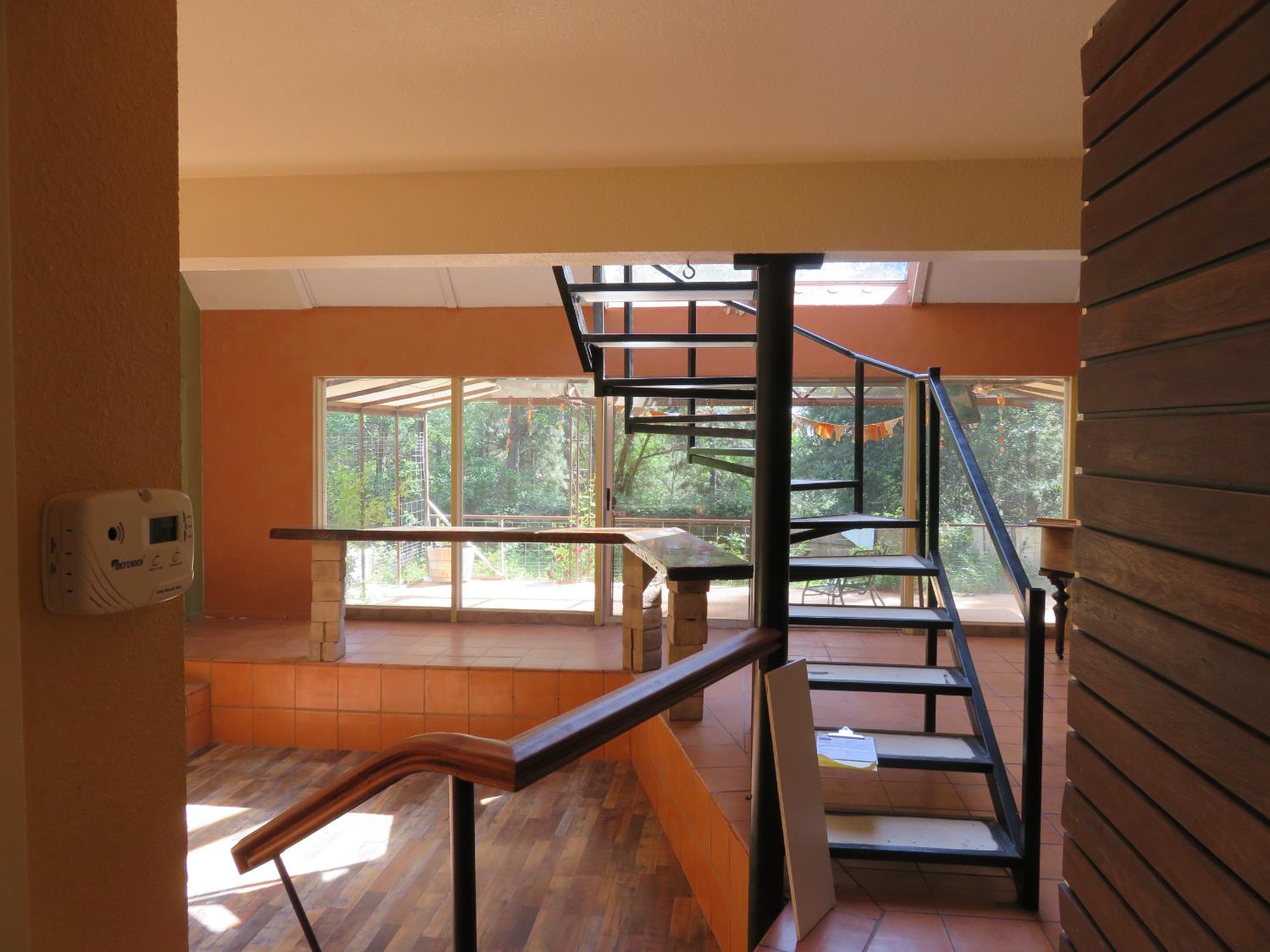 2400 Bald Mountain Road West Point, CA 95255 - Photo 21 of 68 a view of staircase with a floor to ceiling window and wooden floor