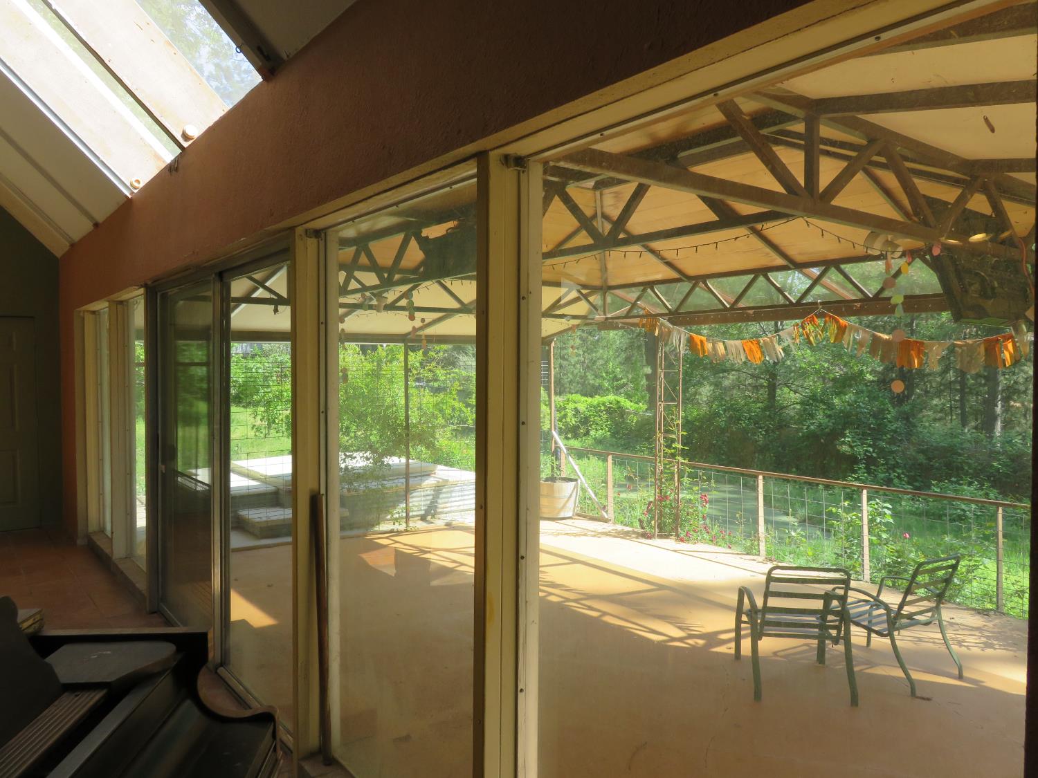 2400 Bald Mountain Road West Point, CA 95255 - Photo 23 of 68 a view of a balcony with chairs and floor to ceiling window