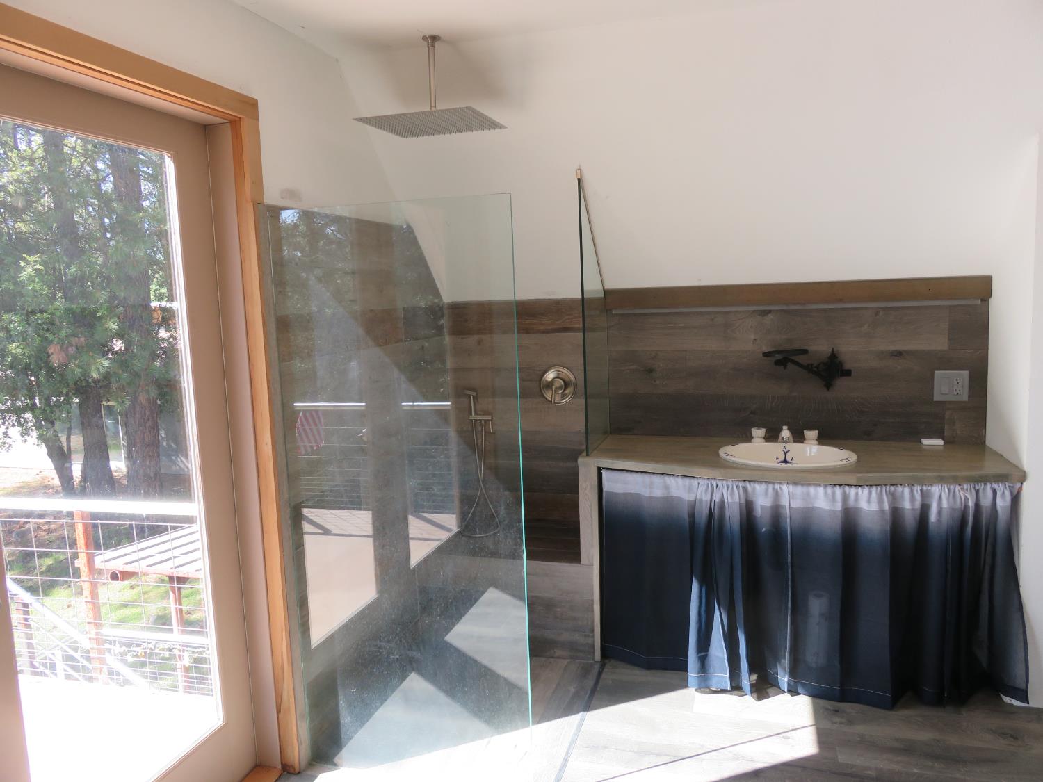 2400 Bald Mountain Road West Point, CA 95255 - Photo 52 of 68 a bathroom with a glass door shower and a sink