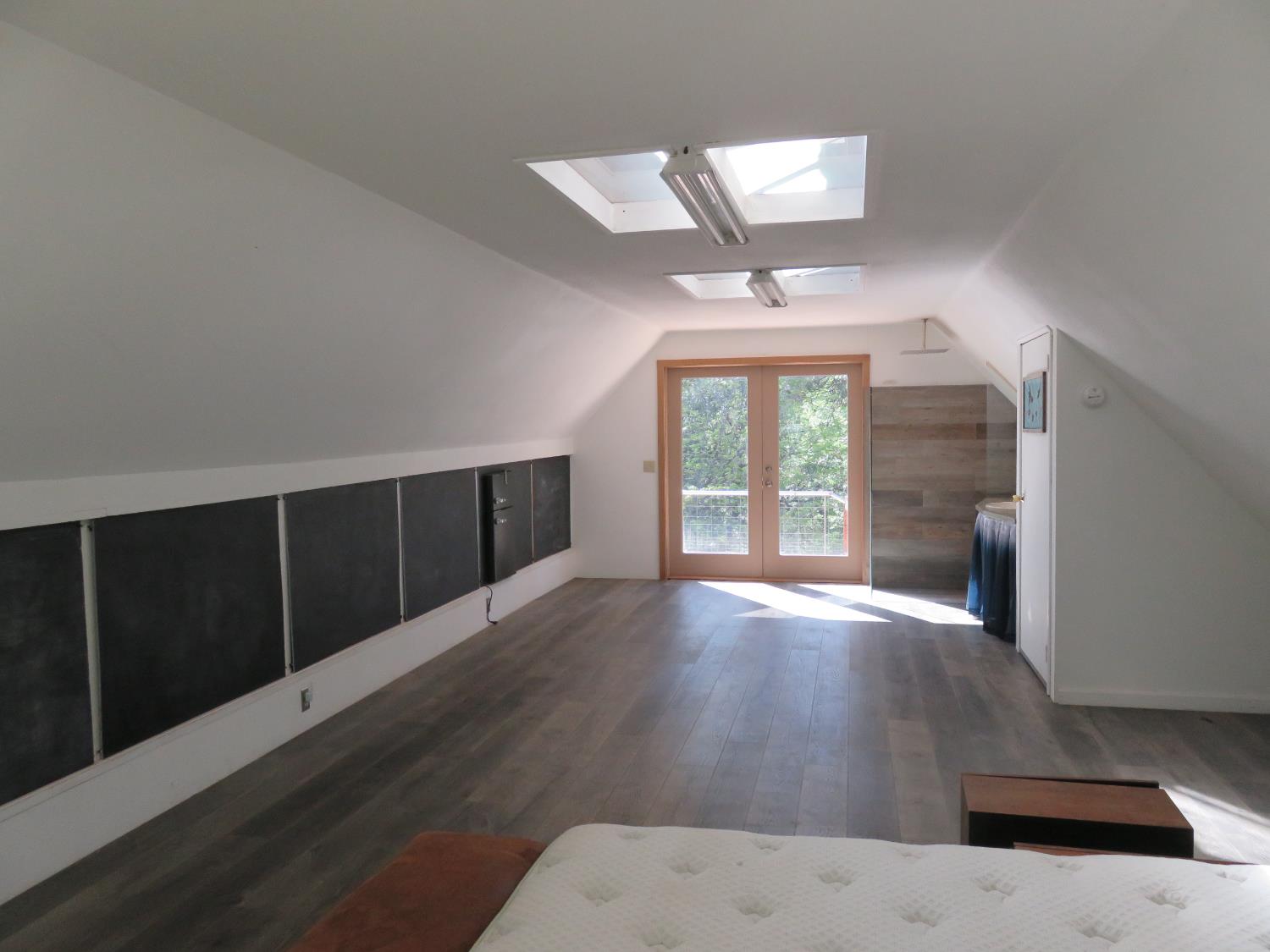2400 Bald Mountain Road West Point, CA 95255 - Photo 54 of 68 a view of an empty room with wooden floor and a window