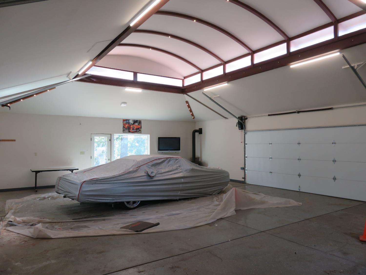 2400 Bald Mountain Road West Point, CA 95255 - Photo 60 of 68 a bedroom with a bed and large windows