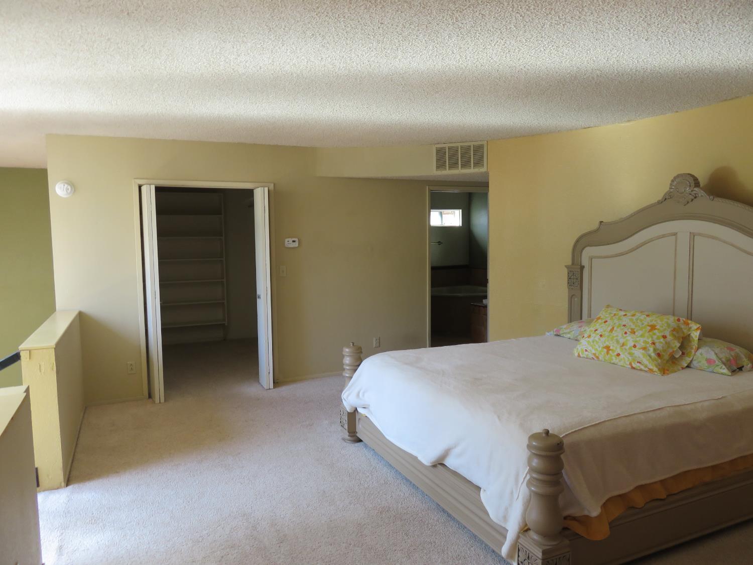 2400 Bald Mountain Road West Point, CA 95255 - Photo 7 of 68 a bedroom with a bed and a walk in closet